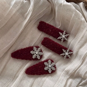 Winter collection wine red snowflake hair clips with pearls and rhinestones on soft fabric
