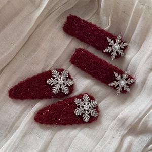 Elegant 4-piece red winter hair clip set with sparkling silver snowflake and pearl accents