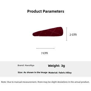 Detail view of burgundy quilted fabric hair clip showing 7cm length and 2cm width