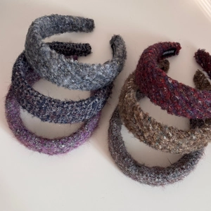 Plush wide-brimmed headband with handmade label in multiple colors and textures