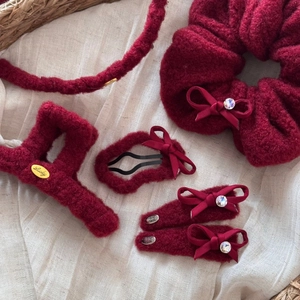 Elegant wine red plush hair accessory set with shark clip and headband in a basket