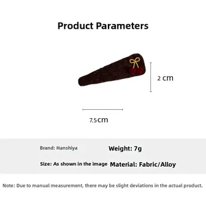 Detailed view showing a cherry bow felt hair clip with dimensions of 7.5cm by 2cm