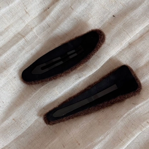 Detailed view of winter plush brown felt BB hair clips with soft faux fur trim texture