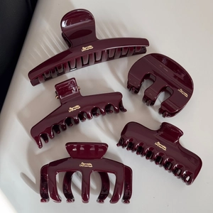 Detailed set of burgundy resin hair claws with gold Barrette La France lettering