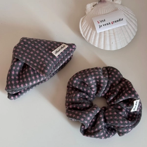 Close-up of handmade dark grey scrunchie set with pink polka dots and fabric accessory
