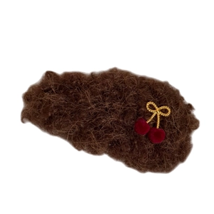 Brown plush hair clip with a delicate red cherry and golden bow charm for women