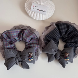 Detailed view of lace hair scrunchies set with checkered pattern and cute mini bear bows