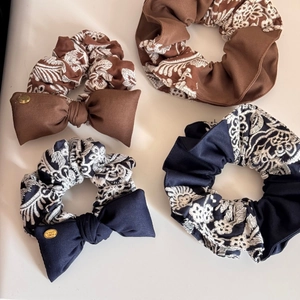 Vintage embroidered knit scrunchie set with large bows and gold metal accents on white background