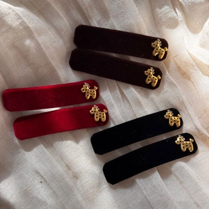 Detail of 6pcs velvet hair clips featuring golden puppy ornaments and rhinestone accents