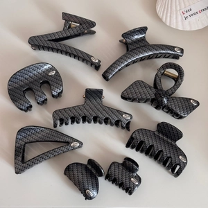 Detailed set of hair claws with premium carbon fiber texture in various elegant shapes