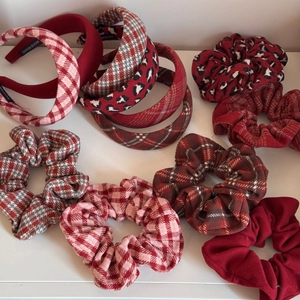 Detail view of red plaid and leopard print wool hairbands and scrunchies set