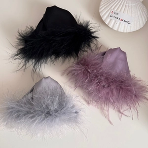 Three elegant satin shark hair clips with fluffy ostrich feathers in black, purple and grey