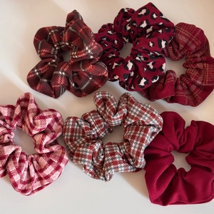 Detail view of 6-piece red plaid and houndstooth scrunchies set for winter accessories