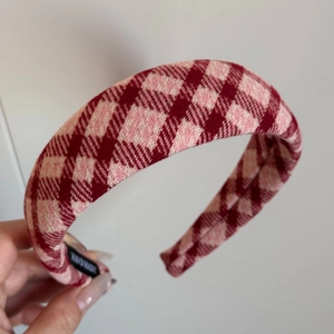 Detailed close-up of handmade pink and wine red plaid tweed headband texture