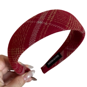 Red plaid wide headband in tweed fabric featuring a black Hand Made label on inner side