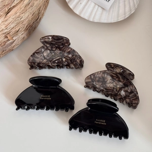 Set of four Korean fan-shaped hair claws in black and tortoiseshell marble patterns