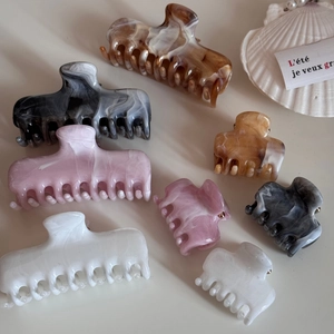 Elegant marble pattern resin hair claws in mixed colors for sophisticated hair styling