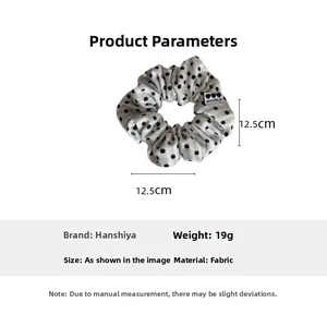Detailed size specifications for the white polka dot fabric scrunchie with heart label