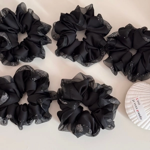 5-pack black satin scrunchies with sequined mesh edges on a minimalist beige background