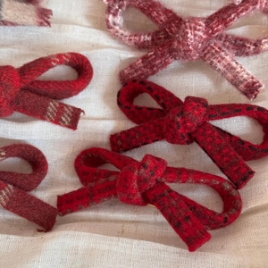 Elegant plaid woolen bow hair clips in various colors with a textured vintage fabric look