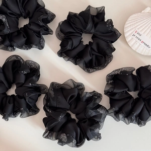 Set of five black satin scrunchies with rhinestone mesh edges on a clean white background