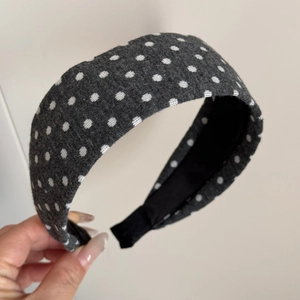 Detailed view of grey polka dot fabric headband featuring premium knitted texture for women