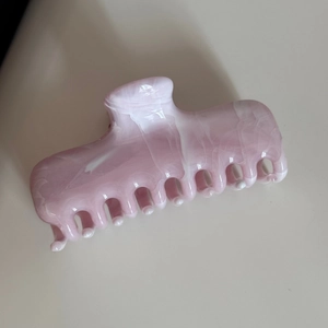 Detail of medium claw clip showing polished pink and white marble ink texture