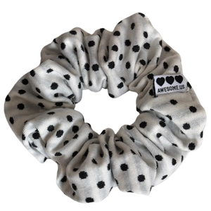 Polka dot fabric scrunchie with Awesome.us label on a clean white background