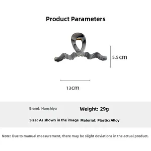 Detail showing grey marble ink hair claw clip with material and 29g weight info