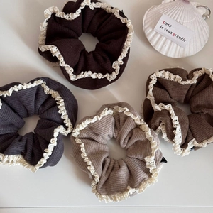 Elegant double-layered knit hair scrunchies with delicate lace trim in earth tones