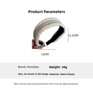 Knitted twist headband details showing 13cm x 15.5cm size and 34g weight parameters