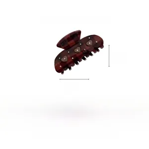 Detail view of a vintage cocoa brown plaid heart hair claw clip with size measurements