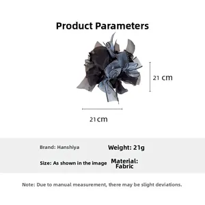 Detailed view of dark fabric flower scrunchie measuring 21cm by 21cm and weighing 21g