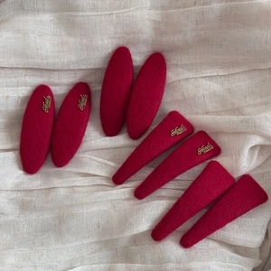Red wool felt BB hair clips in oval and triangle shapes with handmade gold metal tags