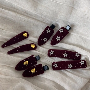 Vintage burgundy velvet hair clips with white polka dots and gold heart star accents
