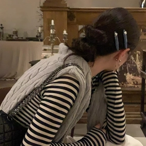 Elegant blue denim stripe hair clips with pearls shown on model in a vintage setting