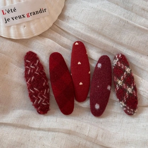 Five-piece red fabric hair clip set with heart embroidery and polka dot patterns