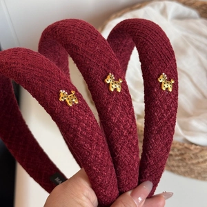 Three-piece set of burgundy tweed padded headbands with elegant golden puppy motifs