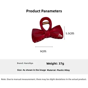 Detailed view of red bow hair claw clip showing 9cm length and 37g weight specifications
