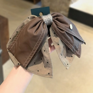 Brown faux leather and polka dot corduroy bow hair clip with a golden metal accent