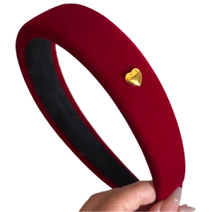 Elegant red velvet padded headband with a golden heart charm for a high crown look