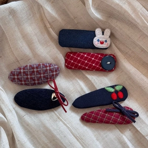 Detail of 6-piece cute rabbit plaid fabric hair clips set with embroidery and bows