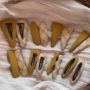 Set of 16 fabric plaid BB hair clips in yellow and blue check on linen background