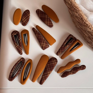 Minimalist fabric plaid hair clip set with brown oval and wavy BB pins on white surface