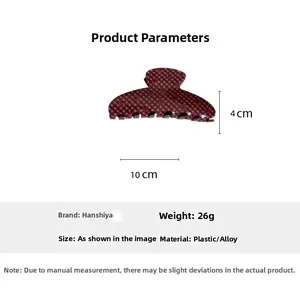 Detail view of red strawberry print hair claw clip showing 10cm x 4cm size dimensions