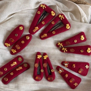 Festive red velvet hair clips with gold RICH letters and lucky coin charms for New Year