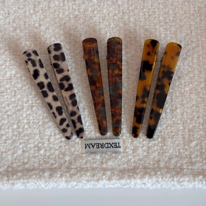 Set of six French leopard print and tortoiseshell duckbill hair clips with metal base