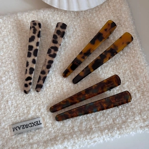 French leopard print acetate duckbill hair clip set of six on soft white fabric