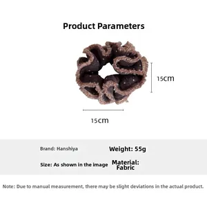 Dettaglio dell'elastico per capelli marrone a pois da 15 cm con bordo in pizzo e peso
