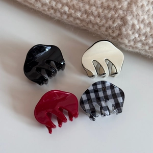 Set of four small acetate hair claws in black, cream, burgundy and plaid checkerboard pattern